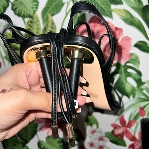 Black heels with gold stylish embellishments